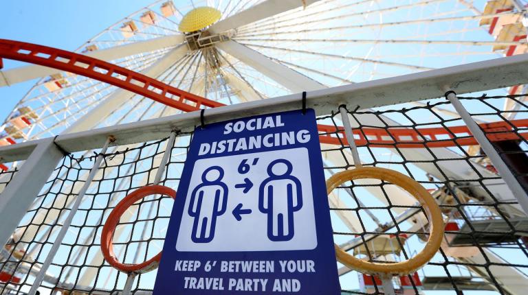 Signage instructs guests to maintain social distancing while visiting Mariner's Amusement Pier as Morey's Piers in Wildwood prepares to fully reopen