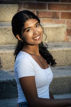 photo of Aanya sitting on steps