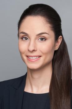 headshot of Alexandra in front of grey background