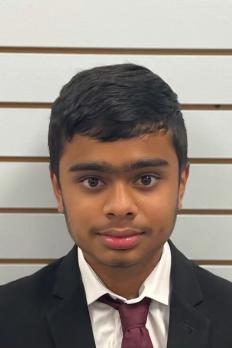photo of Anshul standing in front of a wall