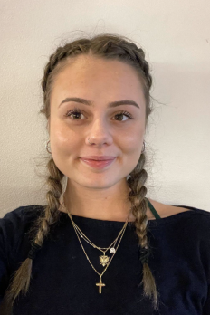 photo of Cindy in front of beige background