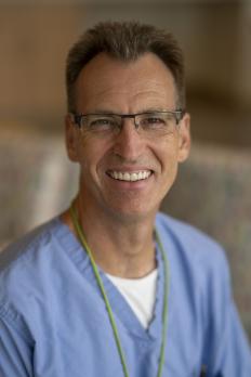 photo of Hendrik in hospital scrubs