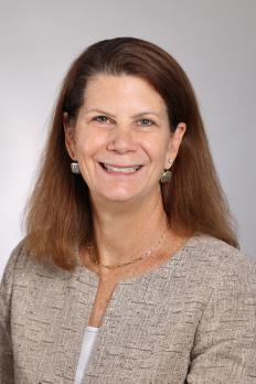 headshot of Kathleen in front of grey background
