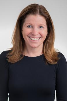 headshot of Michele in front of light grey background