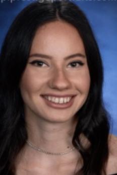 headshot of Michelle in front of blue background