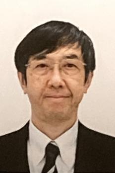 headshot of Shuji in front of cream wall