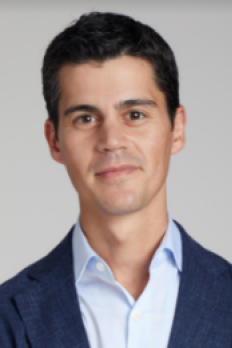 headshot of Steven in navy blaser