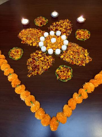 flowers and lights arranged for Diwali