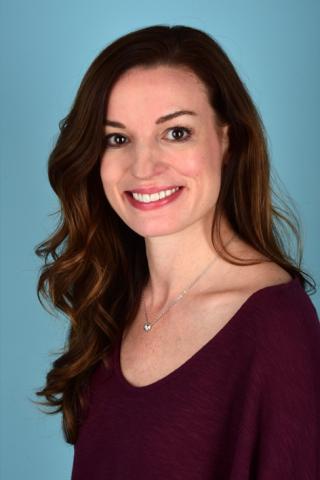 photo of Elizabeth Grice in front of blue background