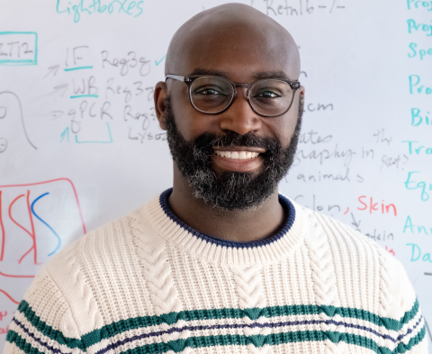 photo of John Brooks standing in front of white board