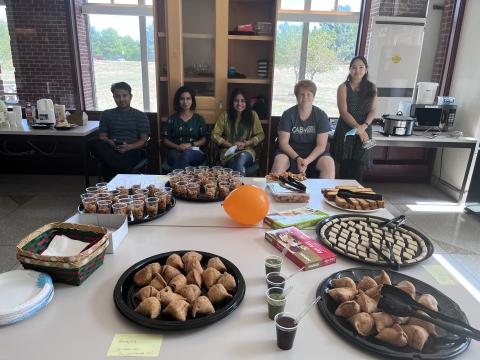 Arnold lab members sitting behind food display