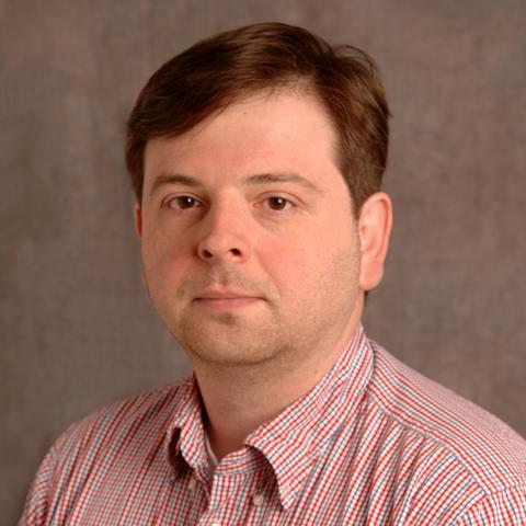 Profile photo of Attila Losonczy in a pink button down shirt