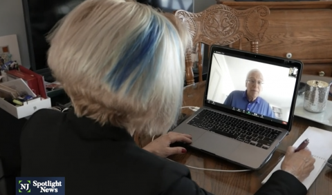 Women looking at laptop with Martin Blaser on screen