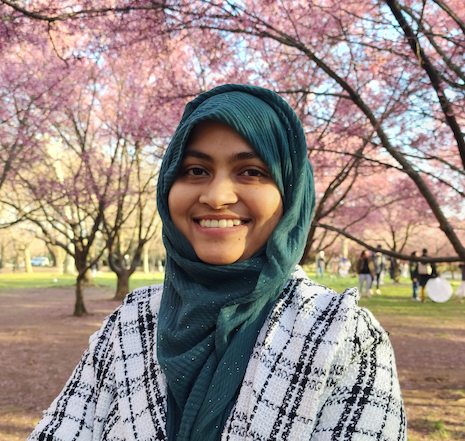 photo of Masuda standing in front of trees