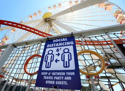 Signage instructs guests to maintain social distancing while visiting Mariner's Amusement Pier as Morey's Piers in Wildwood prepares to fully reopen