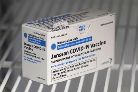 a box of the Johnson & Johnson COVID-19 vaccine is shown in a refrigerator 