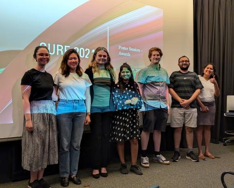 photo of program leaders in front of projector screen