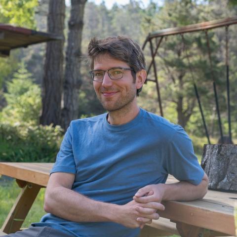 photo of William Ratcliff sitting at bench